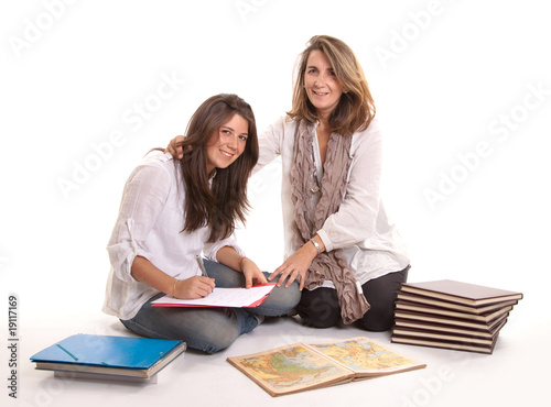 Mother helping her daughter...