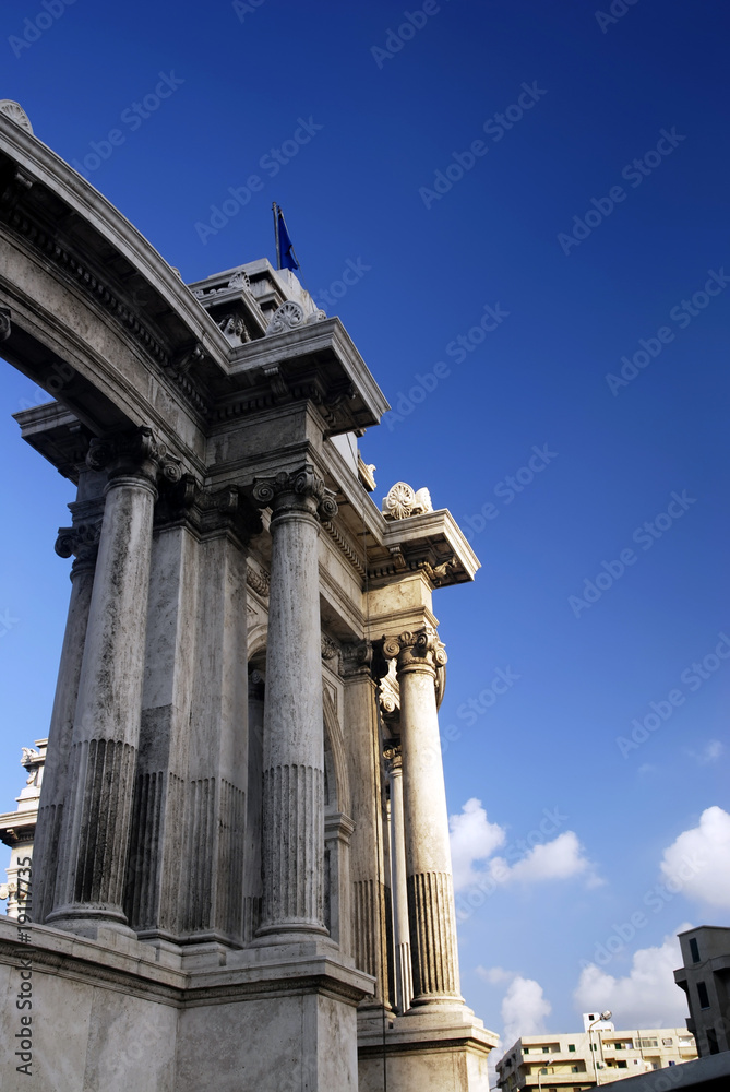 ancient architecture under blue sky of alexandria,egypt
