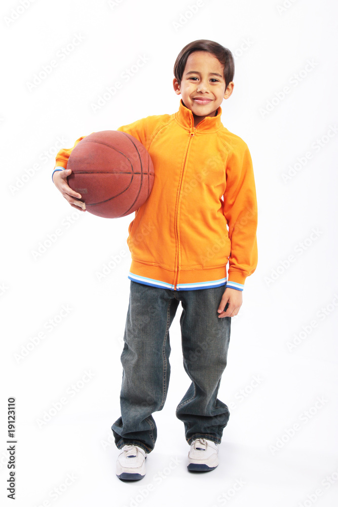 Young boy holding basketball isolated Young boy holding basketball isolated