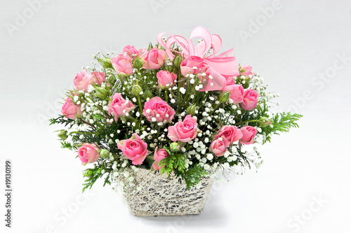 pink roses in a basket