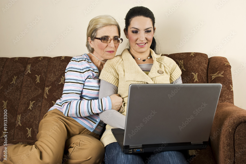 Mother and daughter using laptop Mother and daughter using laptop