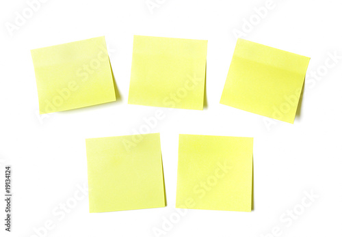 Yellow sticky papers on white background