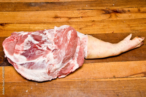 Pork leg on wooden table