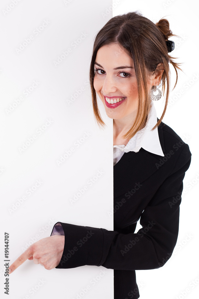 Business women smiling and pointing a blank board Business women smiling and pointing a blank board