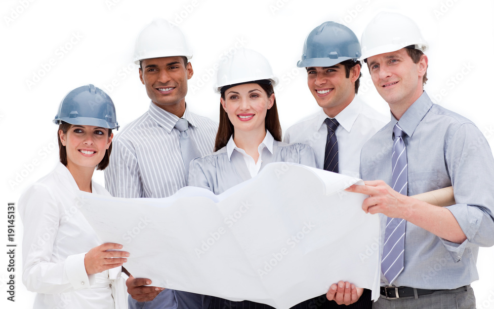 International architects holding a blueprint International architects holding a blueprint
