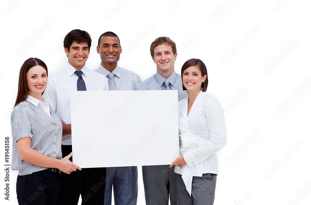 Multi-ethnic business people holding a white card Multi-ethnic business people holding a white card