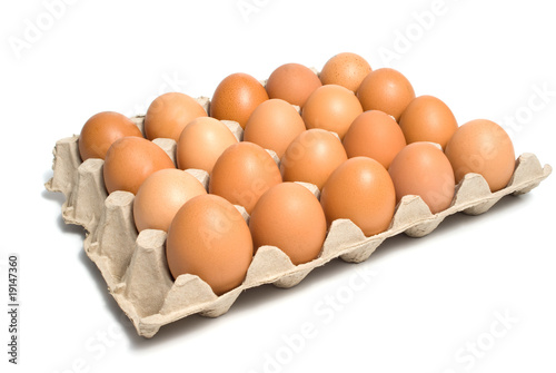 Box with twenty eggs isolated over white