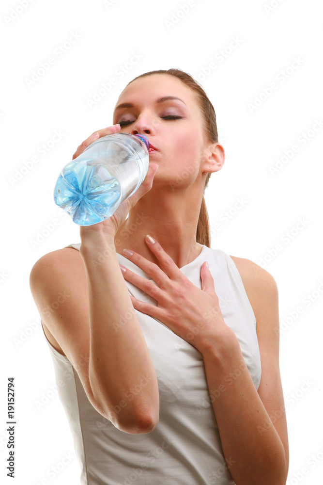 Young woman drinking water isolated on white background.. Young woman drinking water isolated on white background..