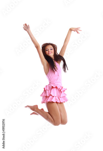 young girl jumping isolated on white