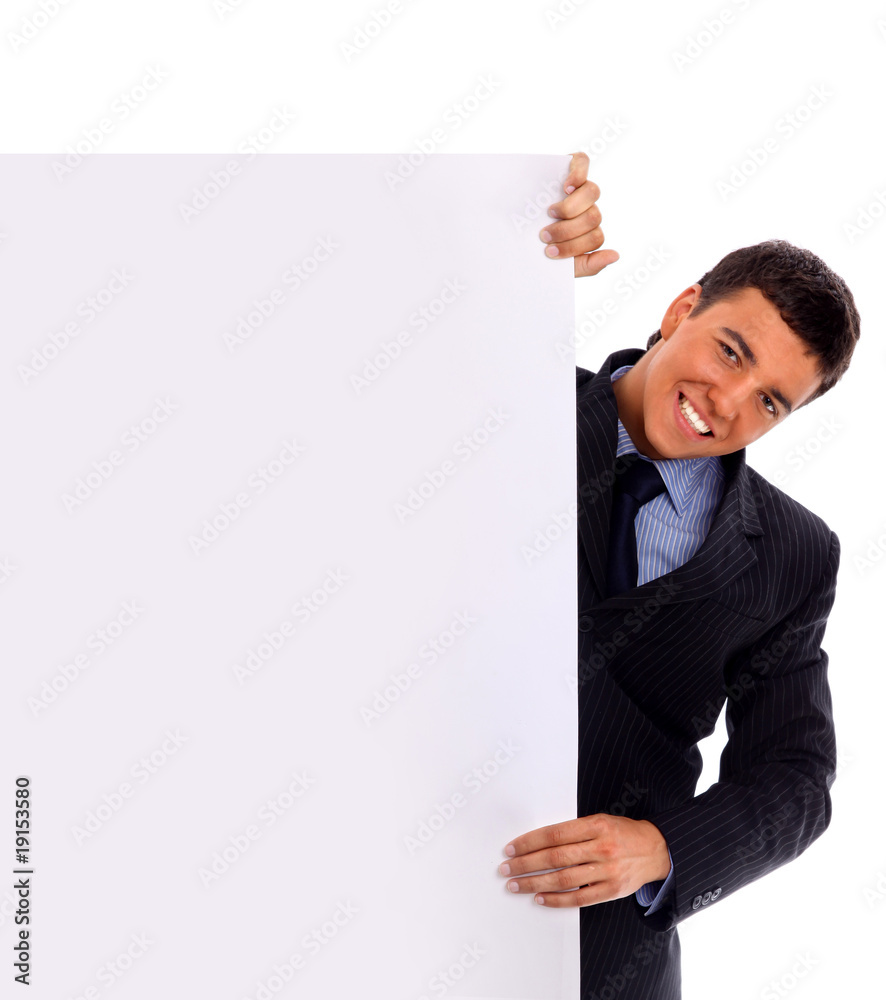 Handsome Businessman holding a blank sign in front of him.. Handsome Businessman holding a blank sign in front of him..