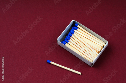 Opened boxes of matches on a color background