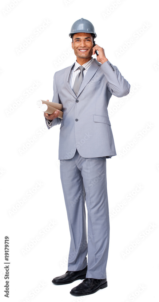 Young Architect on phone carrying blueprints Young Architect on phone carrying blueprints