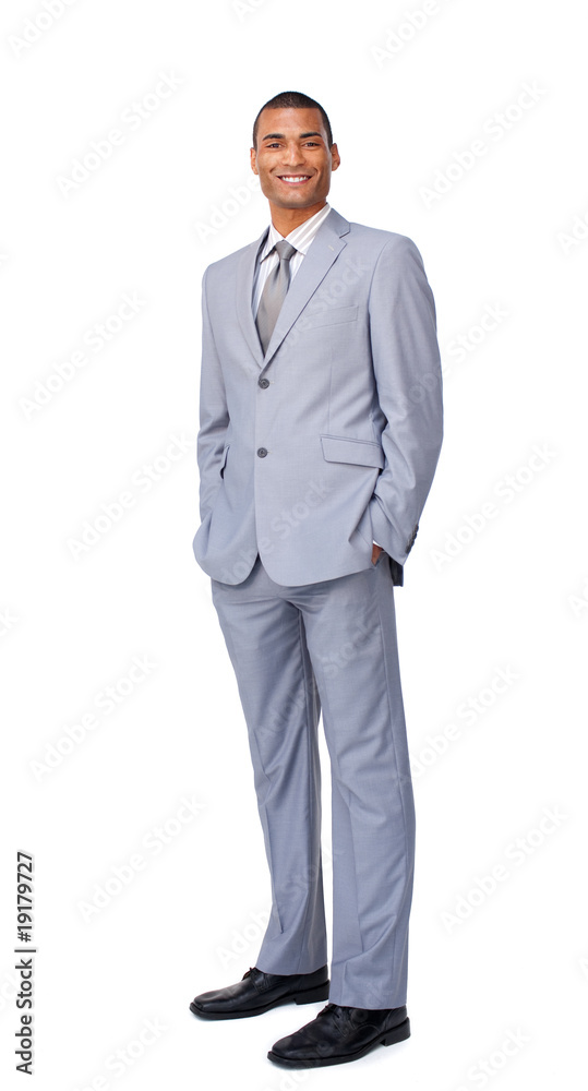 Smiling young businessman with hands in pockets Smiling young businessman with hands in pockets