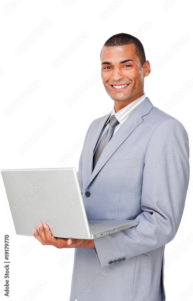 Smiling Confident businessman using a laptop Smiling Confident businessman using a laptop