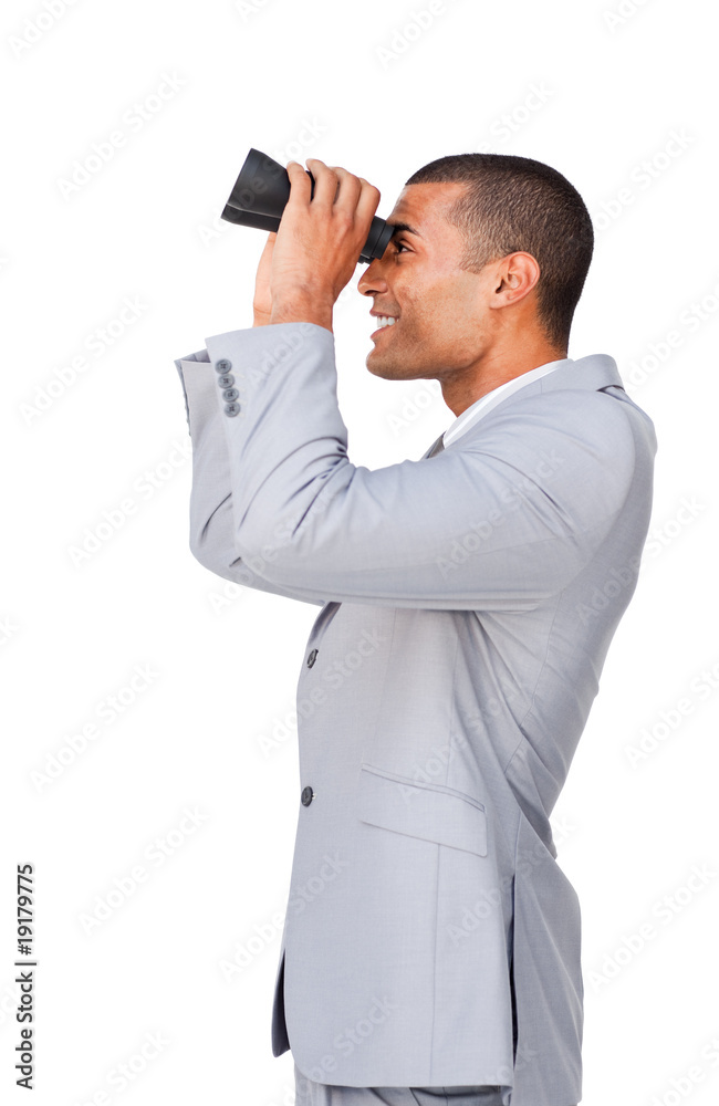 Young afro-american businessman using binoculars Young afro-american businessman using binoculars