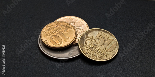 Some modern russian copeck coins on the dark background