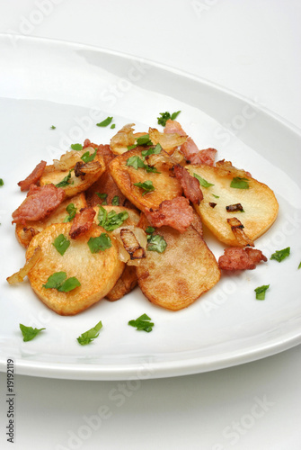 roasted potato with organic bacon on a plate