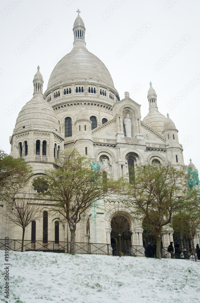 Rare snowy day in Paris. Basilica Sacre-Coeur and lots of snow