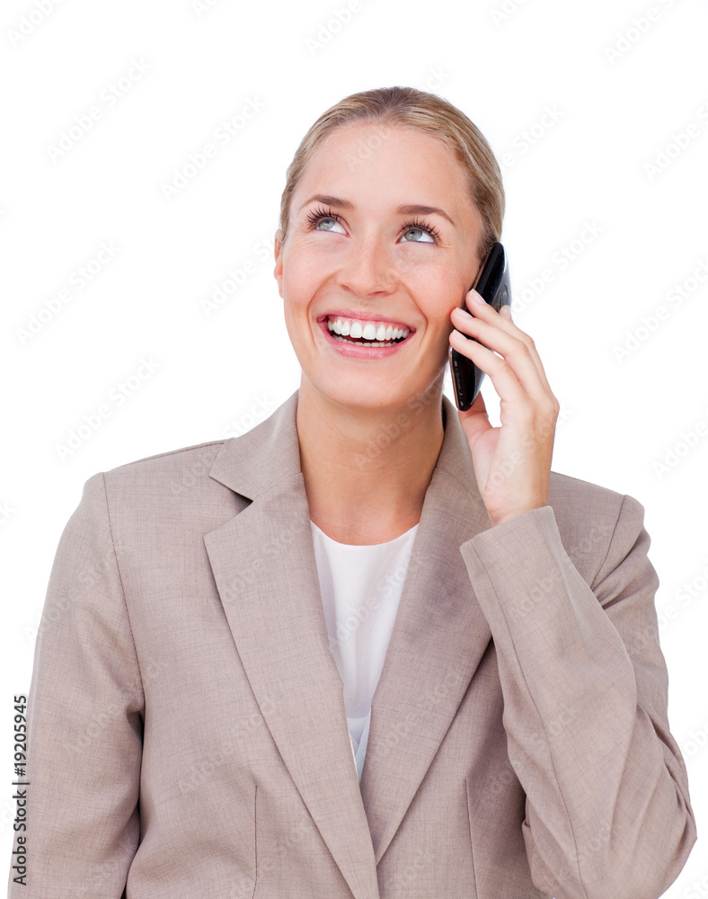 Smiling businesswoman on phone looking up Smiling businesswoman on phone looking up