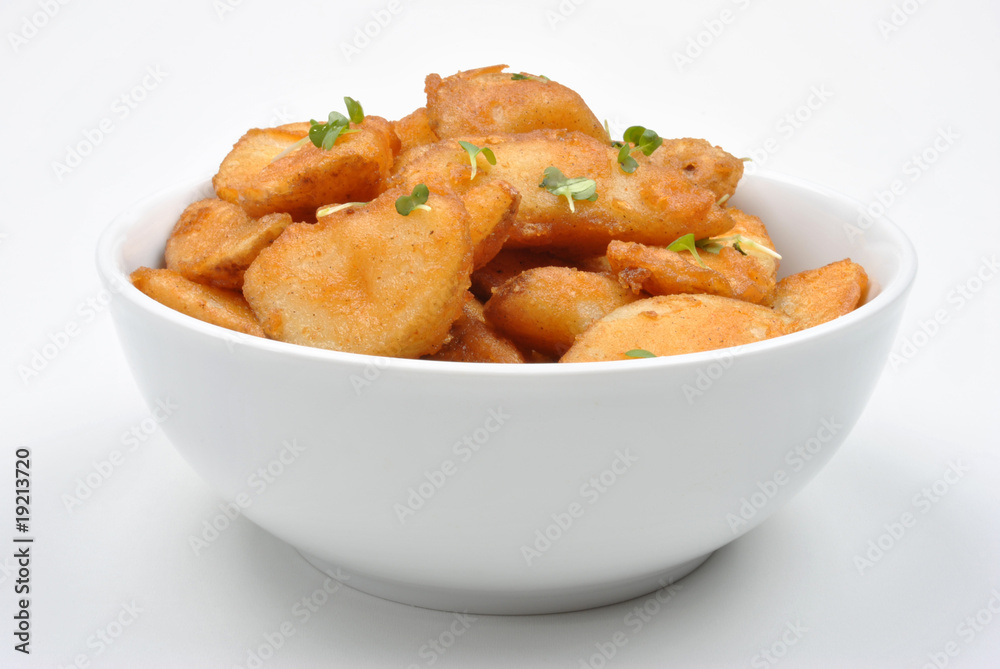 some fried potato wedges in a bowl some fried potato wedges in a bowl