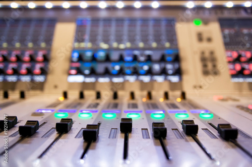 professional audio mixer in a recording studio