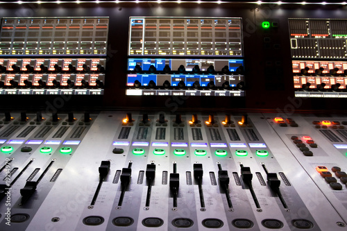 professional audio mixer in a recording studio