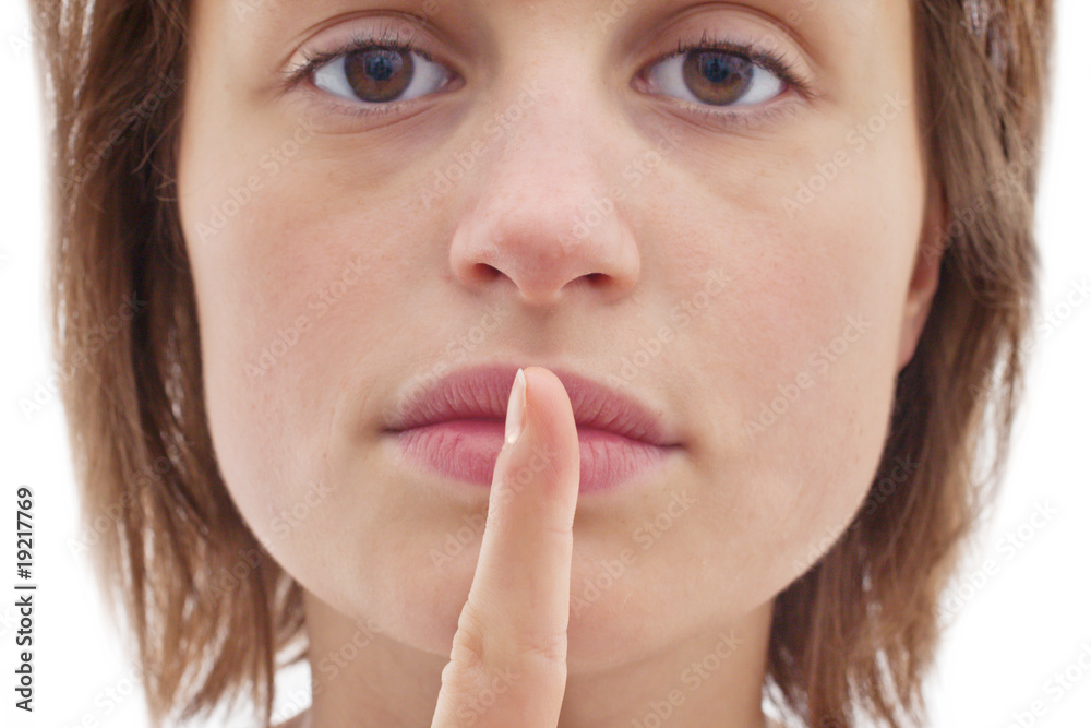 Silence - Cut out of woman with finger to lips Silence - Cut out of woman with finger to lips