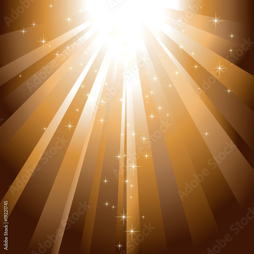 Sparkling stars descending on golden light burst