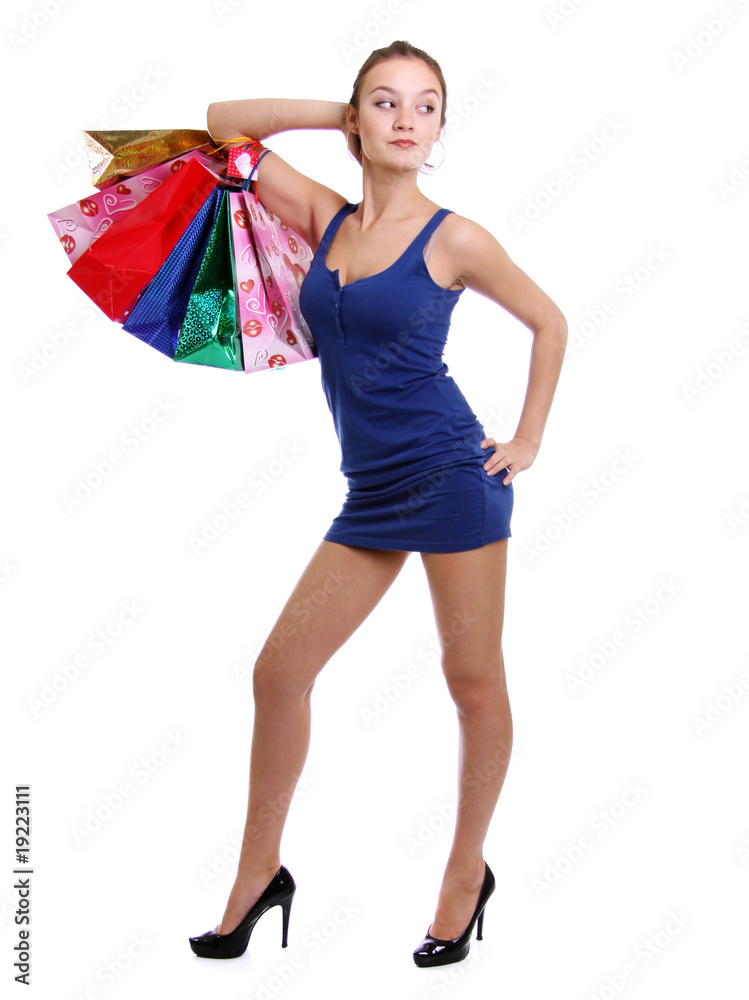 Shopping woman smiling. Isolated over white background