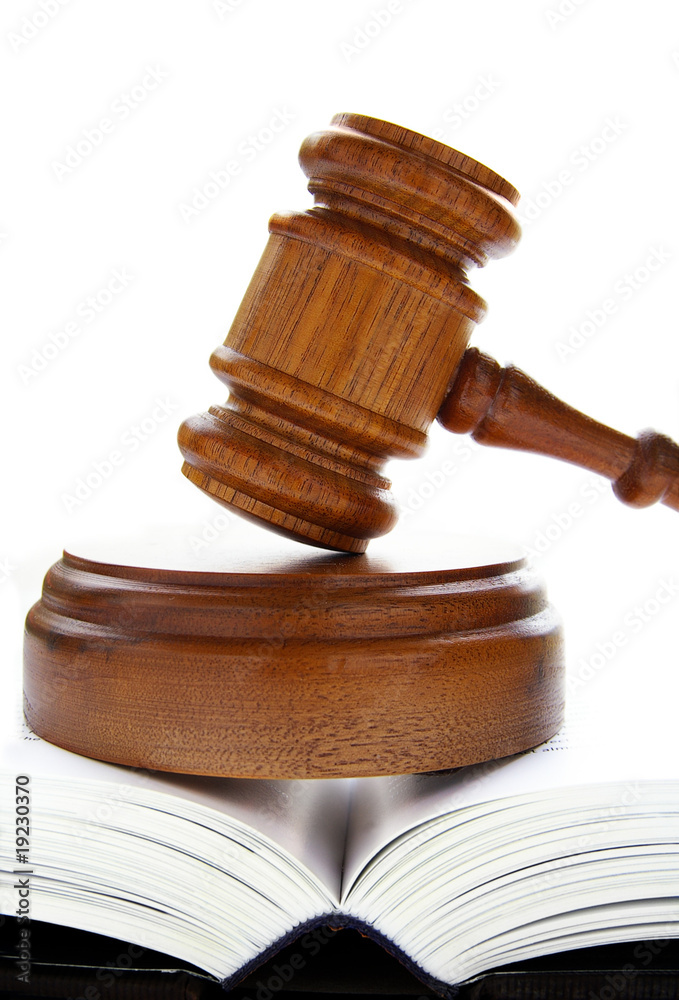 law gavel on an open lawbook, over white