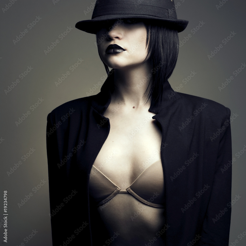 Fototapeta premium Portrait of beautiful stylish woman in hat