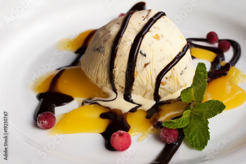 ice cream with frozen berries and sauce