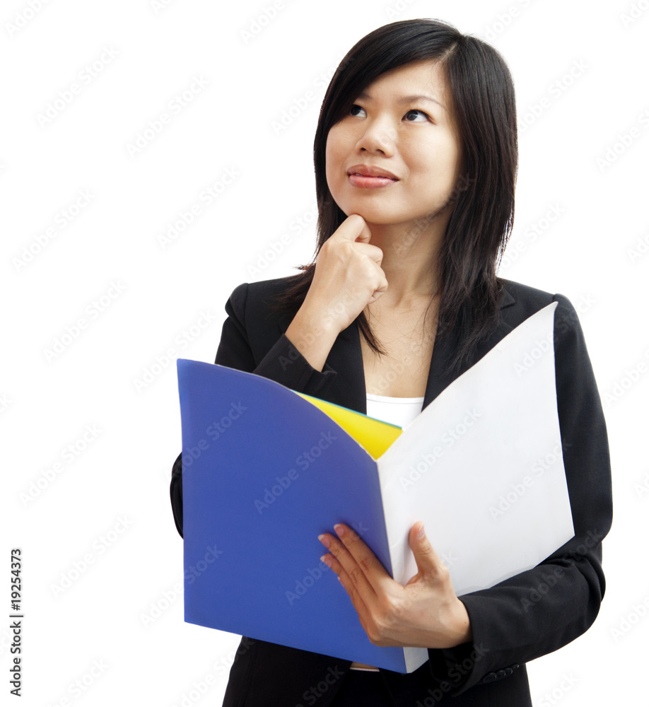 Young women holding file standing having thought. Young women holding file standing having thought.