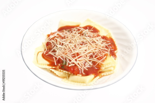 A plate of ravioli with marinara sauce.