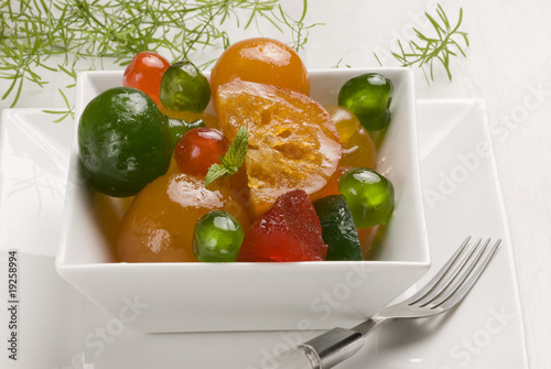 Candied fruits on a bowl. photo