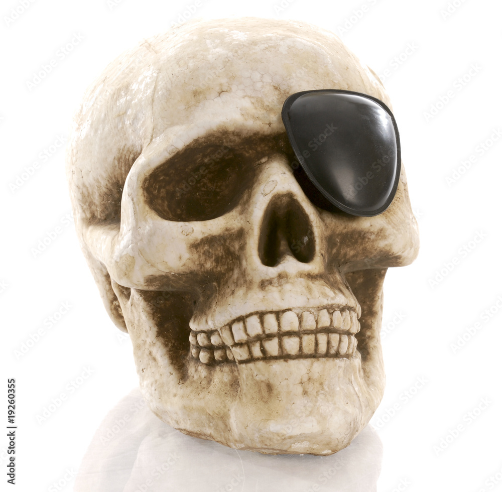 Obraz premium human skull with eye patch on white background