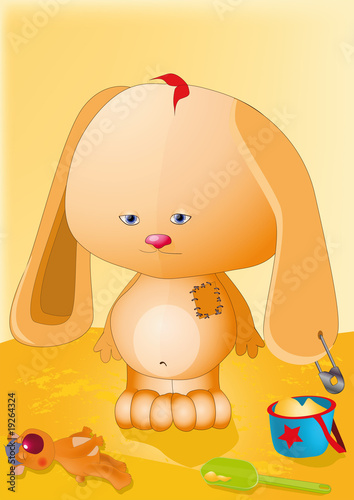 small hare playing to a sandbox