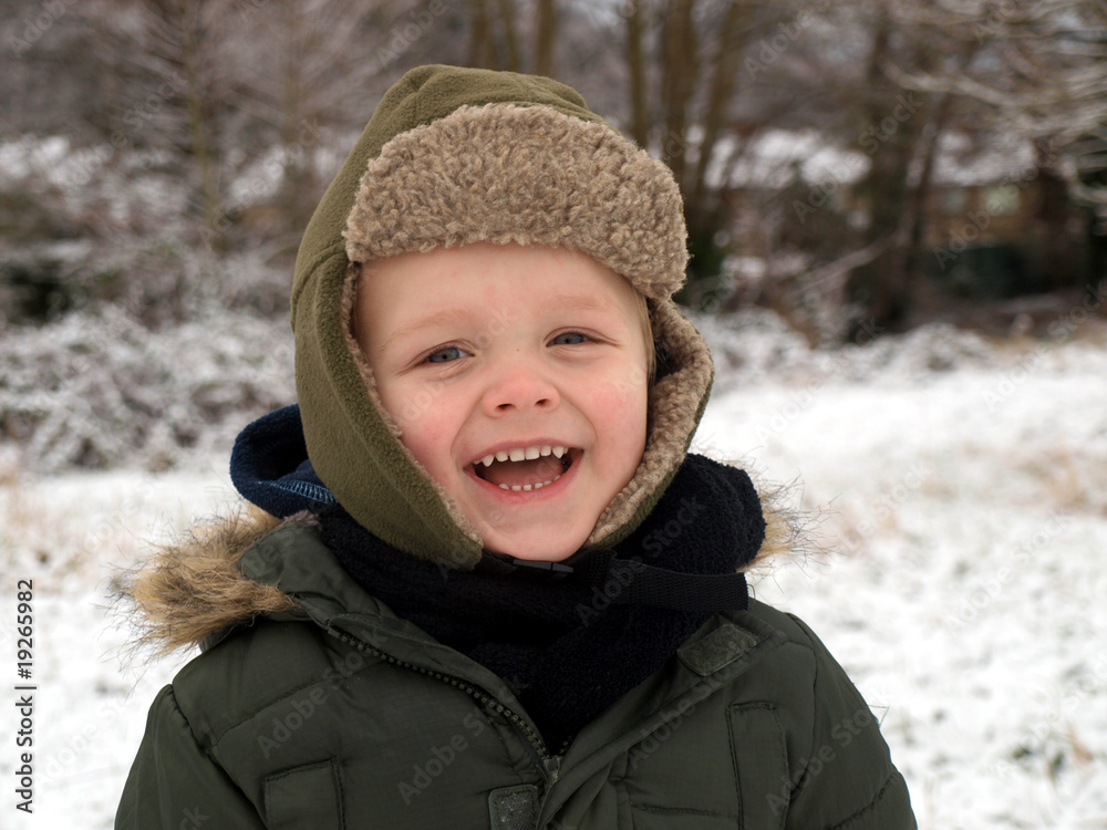 laughing boy on the snow laughing boy on the snow