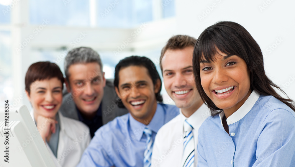 A business group showing diversity smiling at the camera A business group showing diversity smiling at the camera