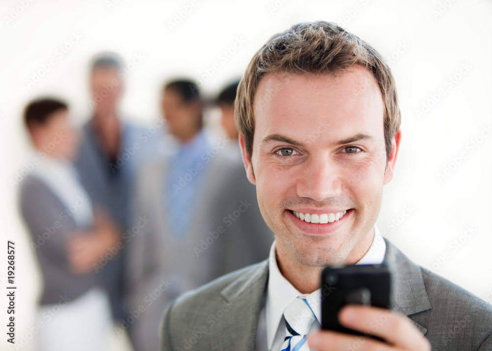 Charming businessman sending a text Charming businessman sending a text