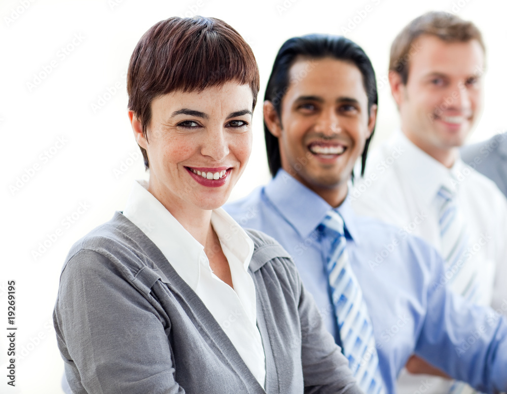 Multi-ethnic co-workers smiling at the camera Multi-ethnic co-workers smiling at the camera