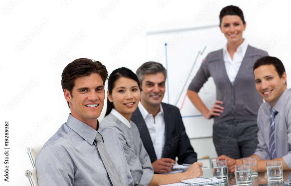Smiling international business people at a presentation Smiling international business people at a presentation