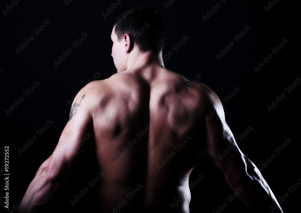 Naklejka premium Back of muscular guy