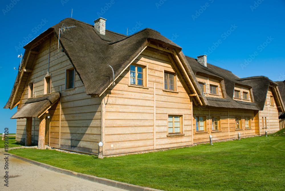 big wooden house with straw roof big wooden house with straw roof