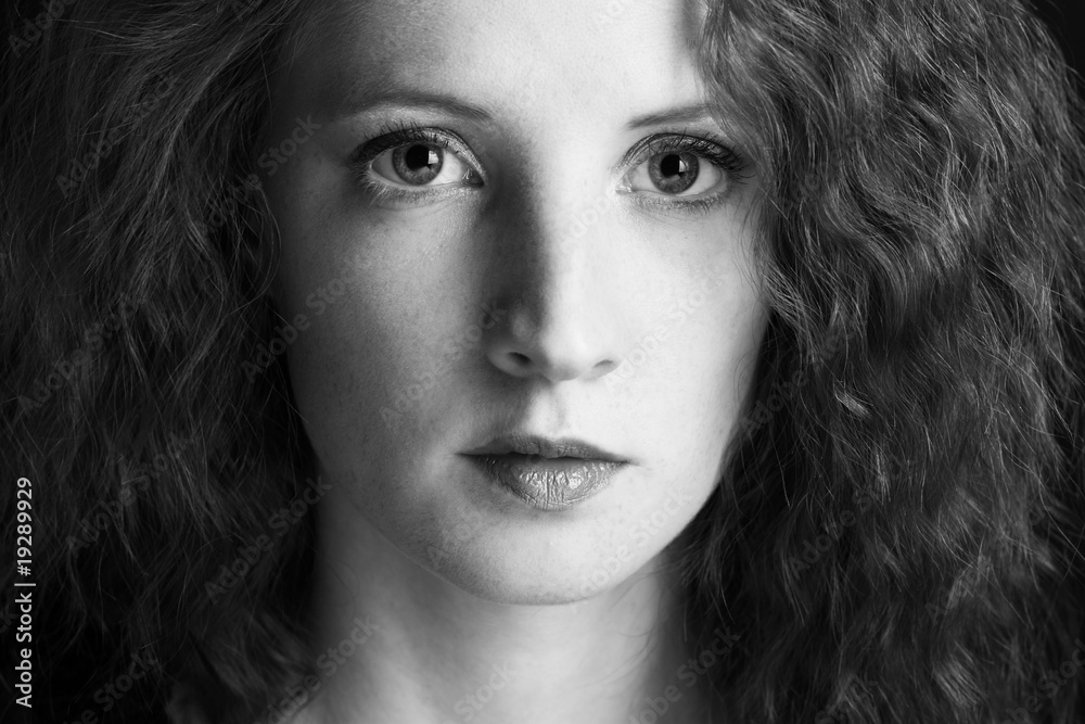 The beautiful girl with curly hair