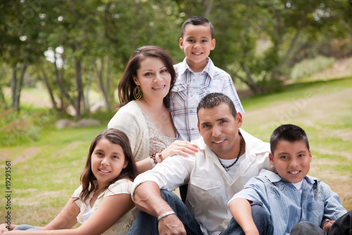 Happy Hispanic Family In the Park