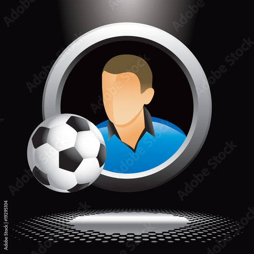 soccer player and ball under spotlight