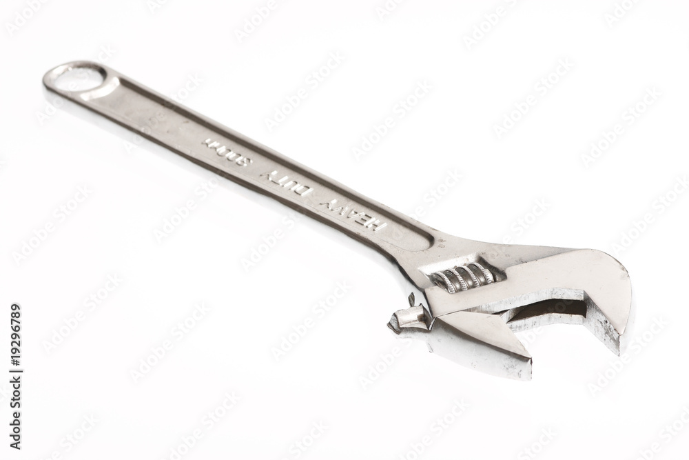 An adjustable crescent wrench isolated on white An adjustable crescent wrench isolated on white