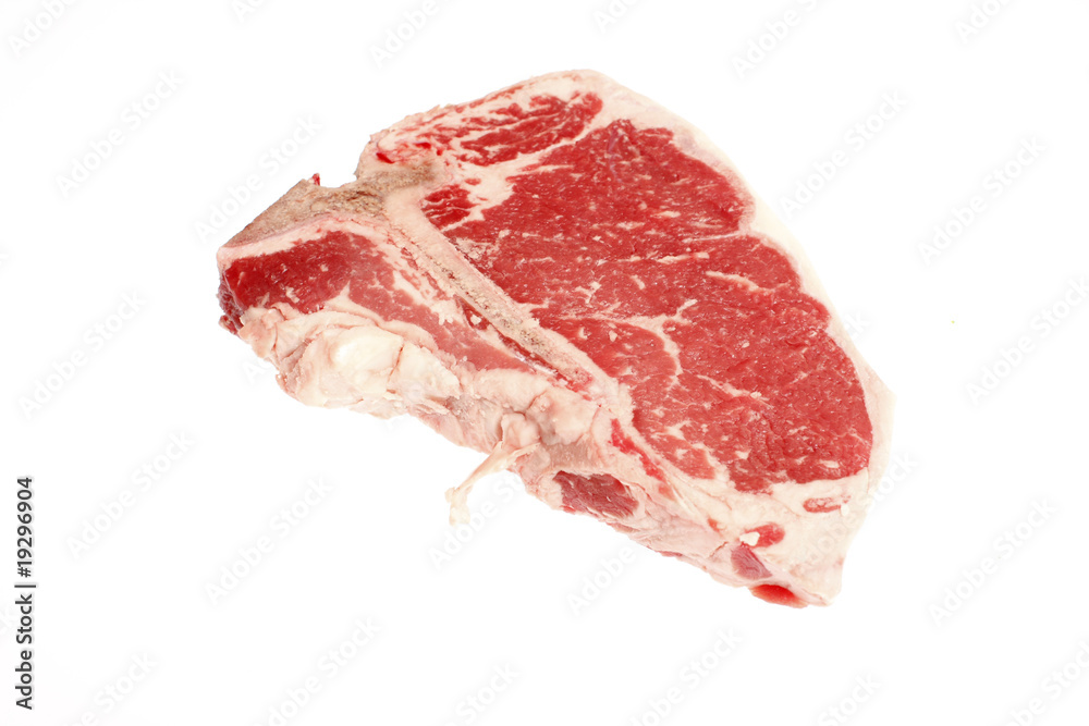 A raw T-bone steak isolated on white