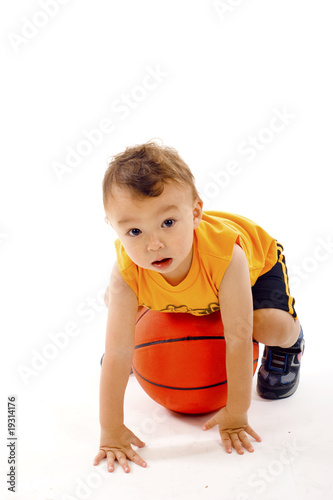 Adorable Baby Boy Playing with a Basketball - Isolated
